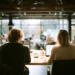 The Ultimate Guide to the Best Coworking Spaces- Productivity Amenities and Community | Alliance Virtual Offices Coworking space with professionals working on laptops, showcasing community and shared amenities
