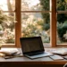 Business Address for Your Online Business- A Sellers Guide | Alliance Virtual Offices Home office desk with a laptop showing email, a stack of mail, and coffee by a sunny window