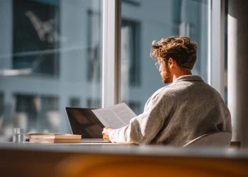 Entrepreneur reviewing business bank account paperwork at a virtual office
