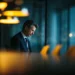 Virtual Office by Industry-Who Uses One and Why | Alliance Virtual Offices Professional businessman working late in a modern office boardroom, representing industry professionals who use virtual office solutions