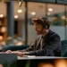 Answering service agent in a headset taking law firm client calls at an office desk