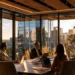 Meeting Conference Room Rental in Houston- How to Book Professional Space | Alliance Virtual Offices Four professionals meeting around a table in a high-rise conference room with floor-to-ceiling windows overlooking a Houston skyline at sunset