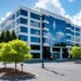Virtual Business Address in Atlanta | Alliance Virtual Offices Modern five-story office building with blue glass facade and landscaped parking lo