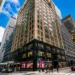 Virtual Mailbox New York- How It Works the Cost and the Legal Rules | Alliance Virtual Offices Midtown Manhattan office building on a busy corner, a prime New York City business address location