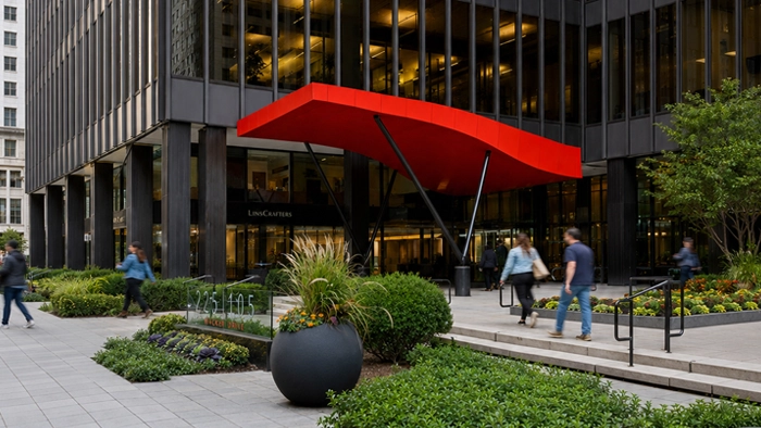 Meeting Rooms in New York City Hourly Daily Rate Guide | Alliance Virtual Offices Pedestrians walking past the landscaped plaza entrance of a modern office tower with a bright red canopy